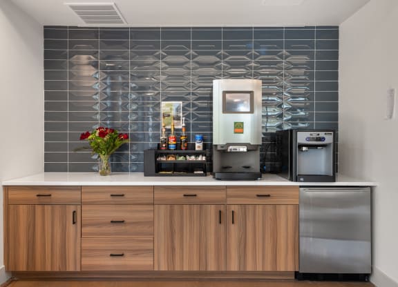 a kitchen with a counter top and a coffee machine