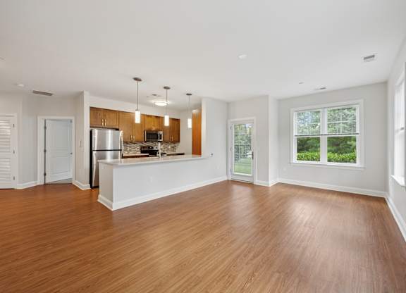 Large empty room with Kitchen view at Heritage Court, Ewing