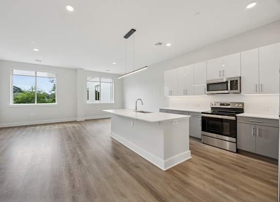 Modern Empty Room with Hardwood Floor and White Walls at Heritage Court, Ewing, New Jersey