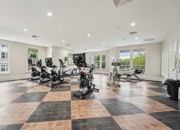 A spacious gym with a variety of exercise equipment.