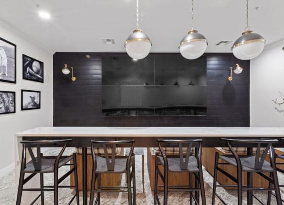 a dining room with a long table and chairs and a fireplace in the background  at Harper's Crossing, Langhorne