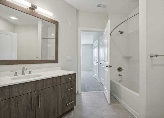 Bathroom with Sink, mirror and white Tub at Heritage Court, Ewing
