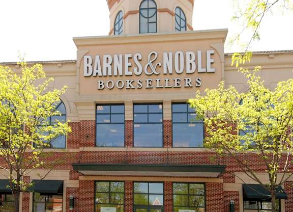 A Barnes & Noble Booksellers storefront with a clock tower.