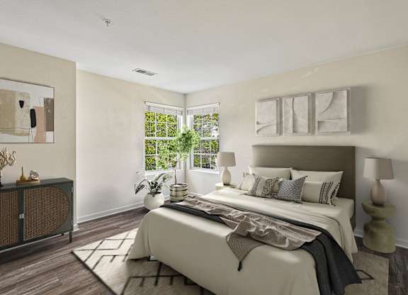 A bedroom with a large bed and a window.