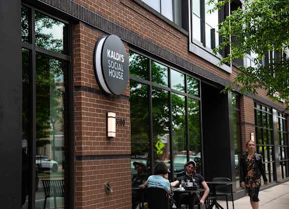 A brick building with a sign that says Kaldi's Social House.
