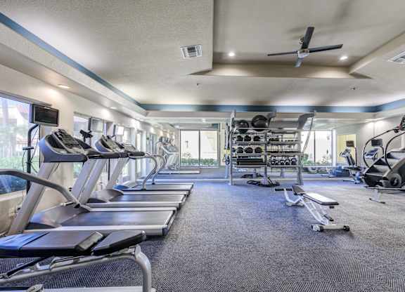 Tresa at Arrowhead Apartments Fitness Center with Treadmills and Weight Racks