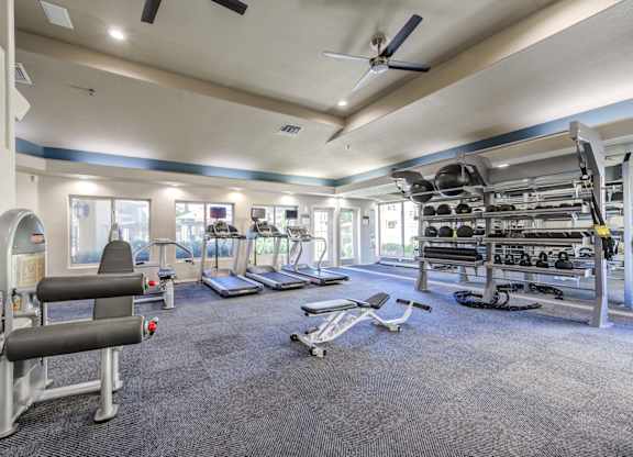 Tresa at Arrowhead Apartments Fitness Center with Treadmills and Weight Racks