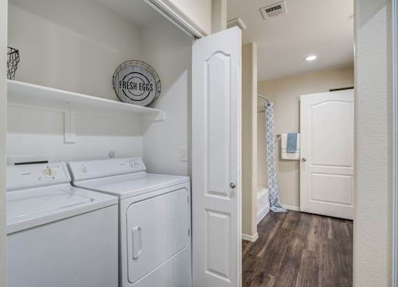 Tresa at Arrowhead Apartments Model Laundry Closet in Bathroom