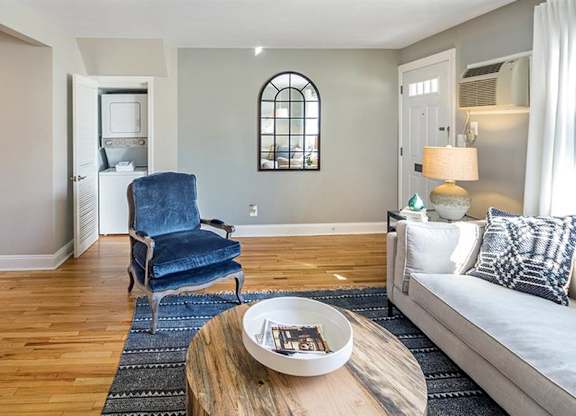 Living area opening up to kitchen area and featuring full size, stack-able washer and dryer at Alister Morristown, New Jersey
