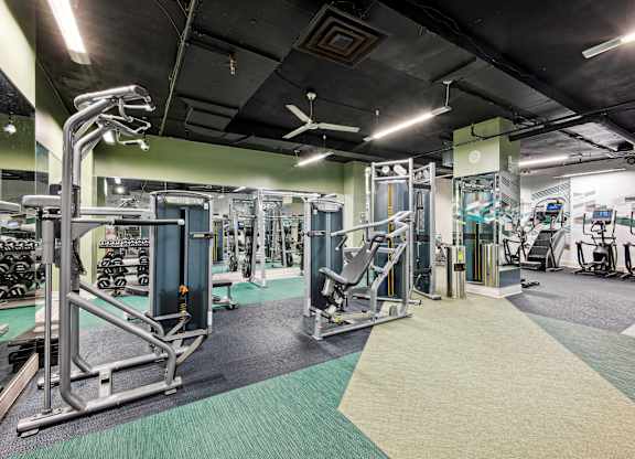 A gym with a variety of equipment at Cascade at Landmark, Virginia