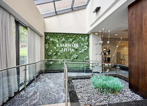 A hallway with a glass wall at Cascade at Landmark, Virginia