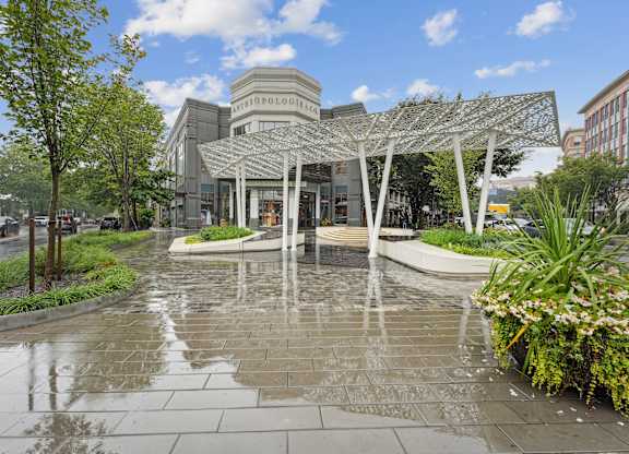 A building with a glass facade and a metal trellis structure in front at Elme Bethesda, Bethesda, 20814