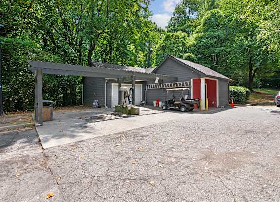 A house with a garage and a car parked in front at Elme Druid Hills, Atlanta, Georgia
