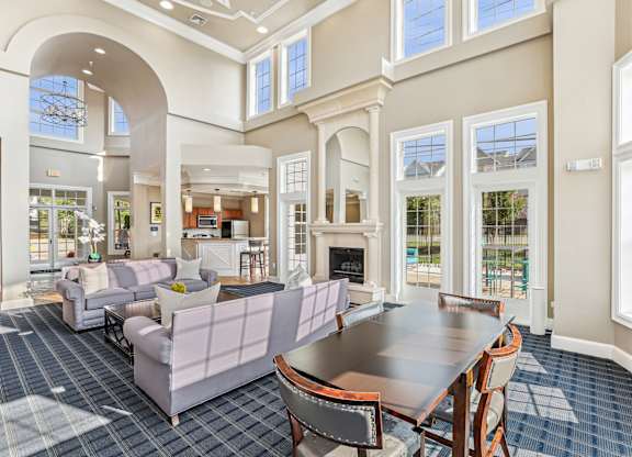 A large room with a dining table and chairs at Elme Dulles, Herndon, VA