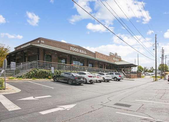 A building with cars parked in front.