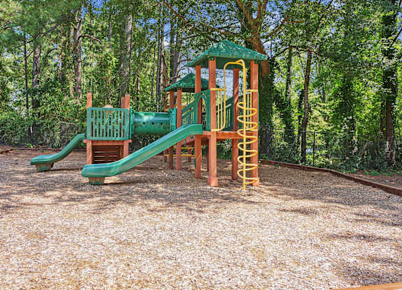 A playground with a green slide at Elme Sandy Springs Apartments, Atlanta, GA, 30350