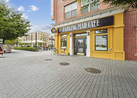 A brick building with a yellow trim