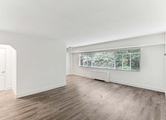A room with a window and a door.