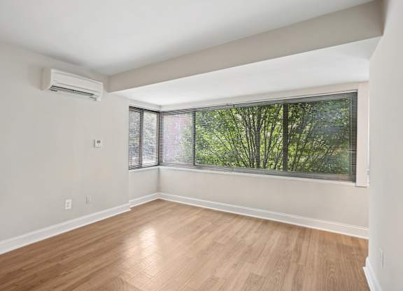 A room with a window and wooden flooring at The Kenmore, Washington, 20015