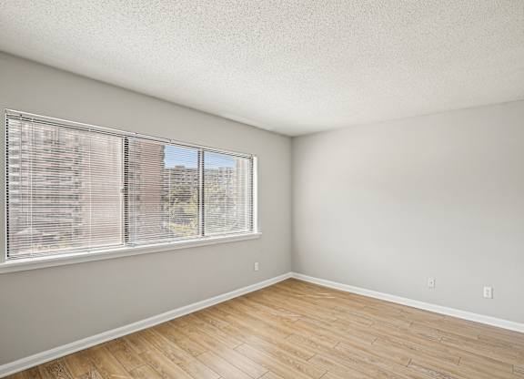 A room with a window and wooden flooring  at The Paramount, Arlington, Virginia