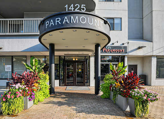 The entrance to a building with a sign that reads