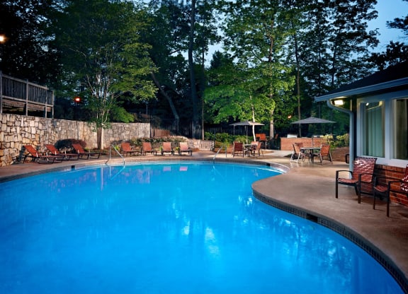 Pool view at night at Elme Cumberland Apartments, Smyrna, GA, 30080