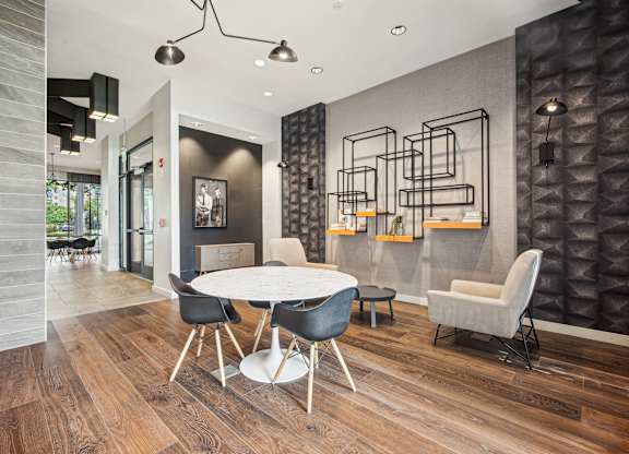 A modern dining room with a white table and chairs at Riverside Apartments, Alexandria, Virginia
