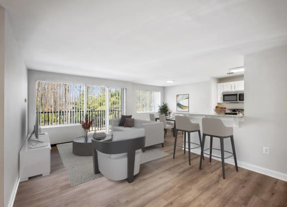 an open living room with a kitchen and a dining room at Roosevelt Towers, Falls Church, VA