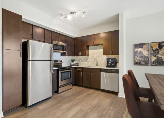Kitchen with stainless steel appliances at The Maxwell Apartments, Virginia, 22203