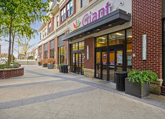 A brick building with a purple sign that says Giant.