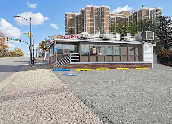A small building with a red sign that says