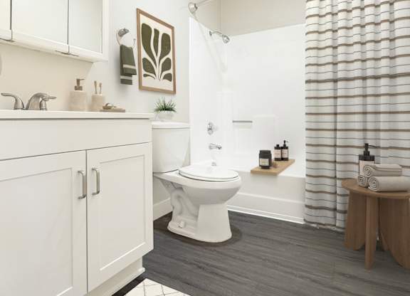 A white bathroom with a toilet, sink, and shower.