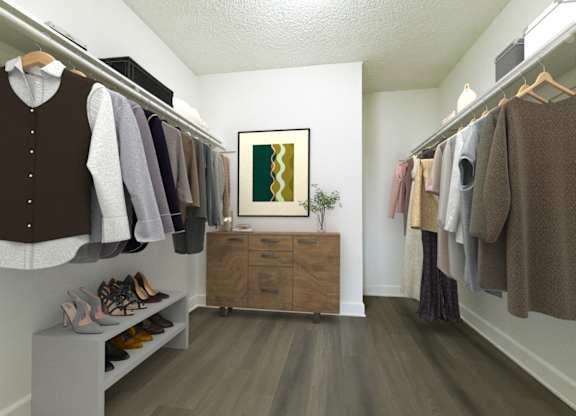 A room with a brown sweater hanging on a rack.