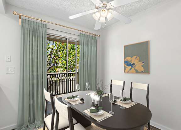 Dining Nook in 955 Via Zapata apartment home with wood-style plank flooring, an overhead ceiling fan, and sliding doors leading to a private balcony.