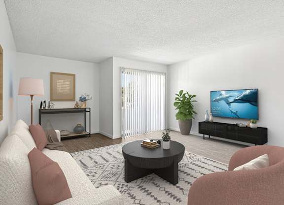 Spacious living room in 1005 Via Zapata apartment home with wood-style plank flooring and sliding doors leading to private patio