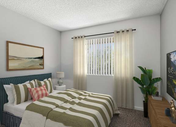 Additional angle of Oversized bedroom in 955 Via Zapata apartment home. Entryway inside the bedroom has wood-style plank flooring, a large closet with mirrors and a hallway on the right leading to a private vanity area and private bathroom.  Left side of room has plush carpeted flooring and large windows allowing for gorgeous natural lighting.