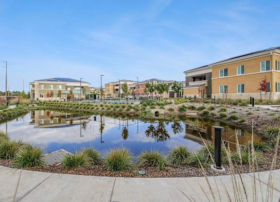 Serene pond on walkway path at The Park Apartment homes
