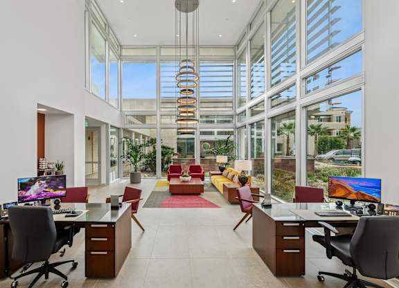 Gorgeous leasing office at The Park with huge windows, breathtaking architecture and plenty of lounge seating.