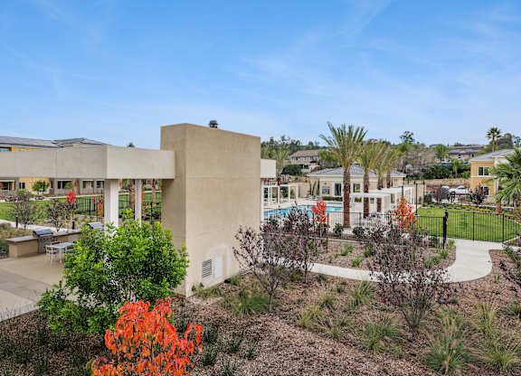 Overview of the grounds at The Park with beautiful park-like landscaping and views of the resort-style pool