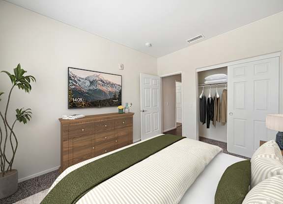 A bedroom with a large bed and a painting on the wall.