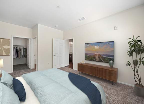 Spacious bedroom in Turtle Creek Apartment home with plush carpeted flooring, a spacious closet, and large window allowing for gorgeous natural lighting