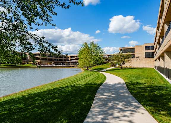 A pathway runs alongside a body of water.