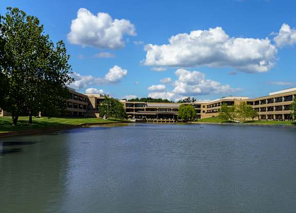 A large body of water in front of a building.
