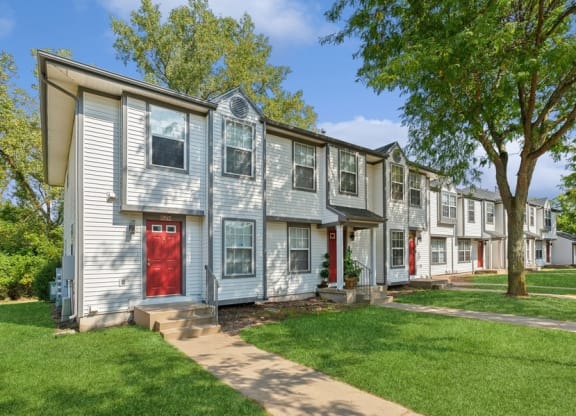 A row of town houses with a red doorat Mason Street Townhomes, Grand Rapids, MI