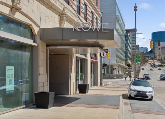 a car parked in front of a hotel on a city street at The Rowe, Grand Rapids, 49503