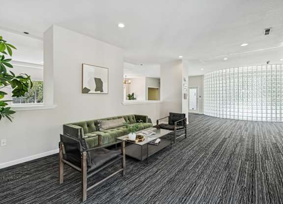 Rroom with carpet floors and chairs