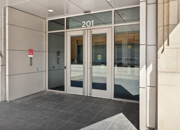 front doors of a building with the number 2100 on it at The Rowe, Grand Rapids, 49503