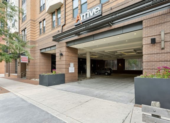 a large brick building with an entrance and a sign on the side