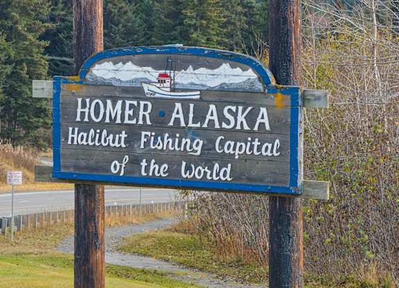 A sign that says Homer Alaska Halibut Fishing Capital of the World.