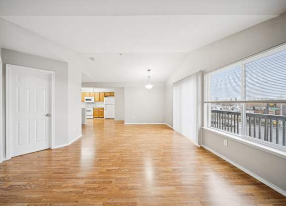 A room with wooden floors and white walls.
